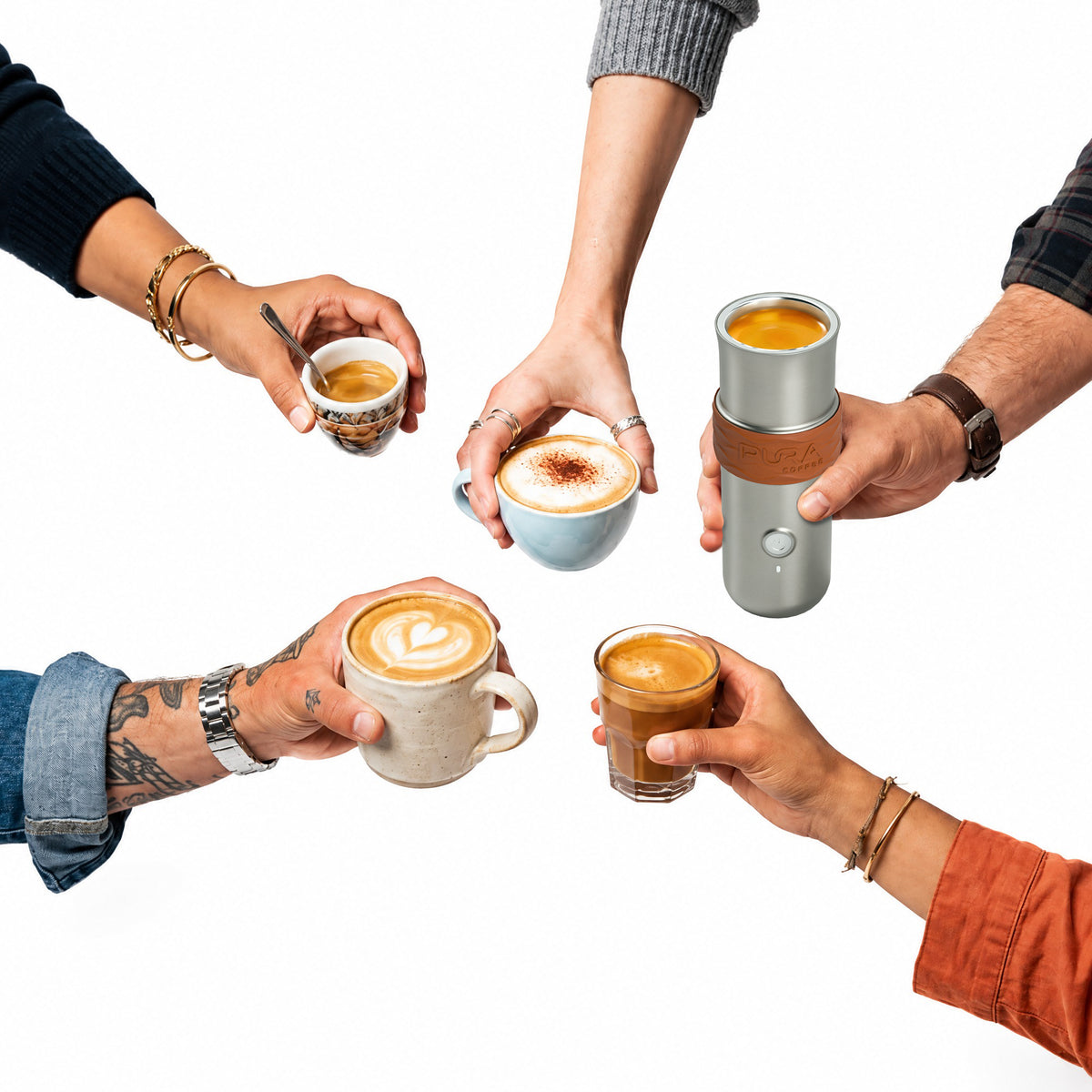 Friends toasting with espresso drinks brewed by the PURA NEO Pro